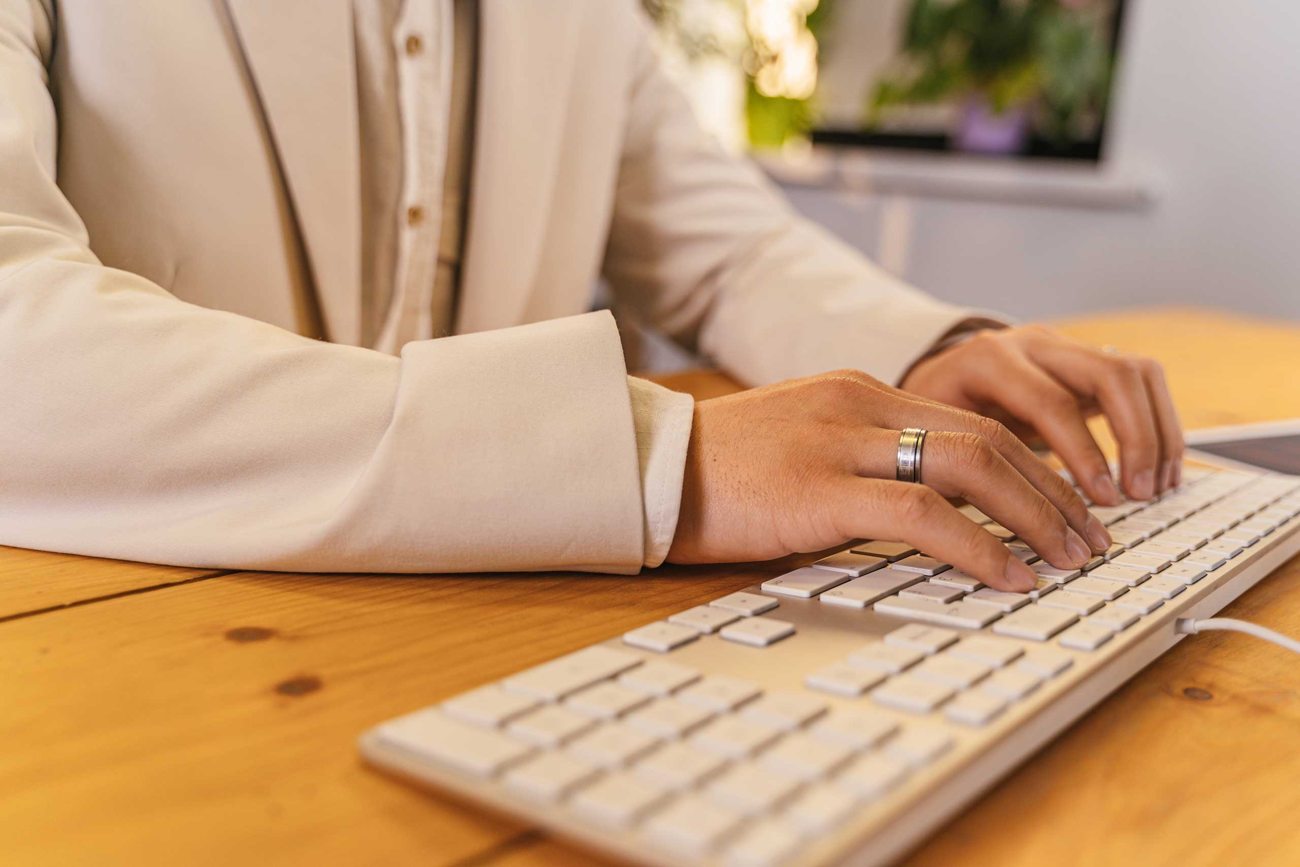 a woman typing on a keyboard